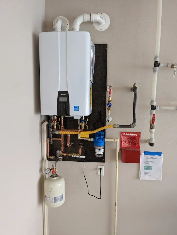 Professional plumber installing copper piping in a Caseyville home